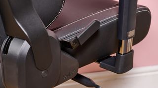 Close-up of recline lever on Boulies Elite with pink background