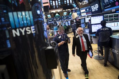 Traders on the NYSE floor as tech stocks surge