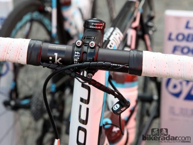 Ag2r-La Mondiale team mechanics use sections of plastic wire wrap to tidy up the front ends