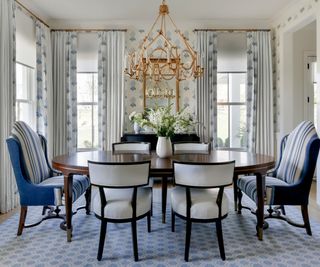Traditional blue and white dining room with large windows