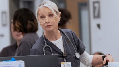 Dana looks at something down the hall