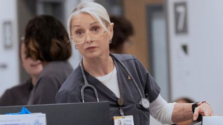 Dana looks at something down the hall