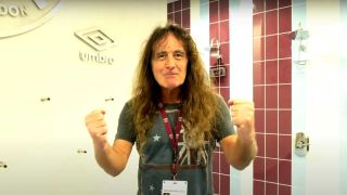 Steve Harris raiding his fists in triumph