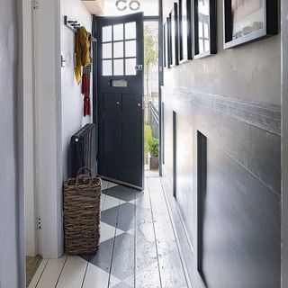 Narrow hallway with stencilled floorboards