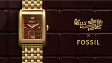 The Fossil x Wonka watch on a brown background