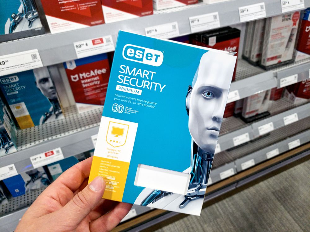 A hand holding a Eset Smart Security Package 