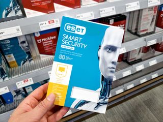 A hand holding a Eset Smart Security Package
