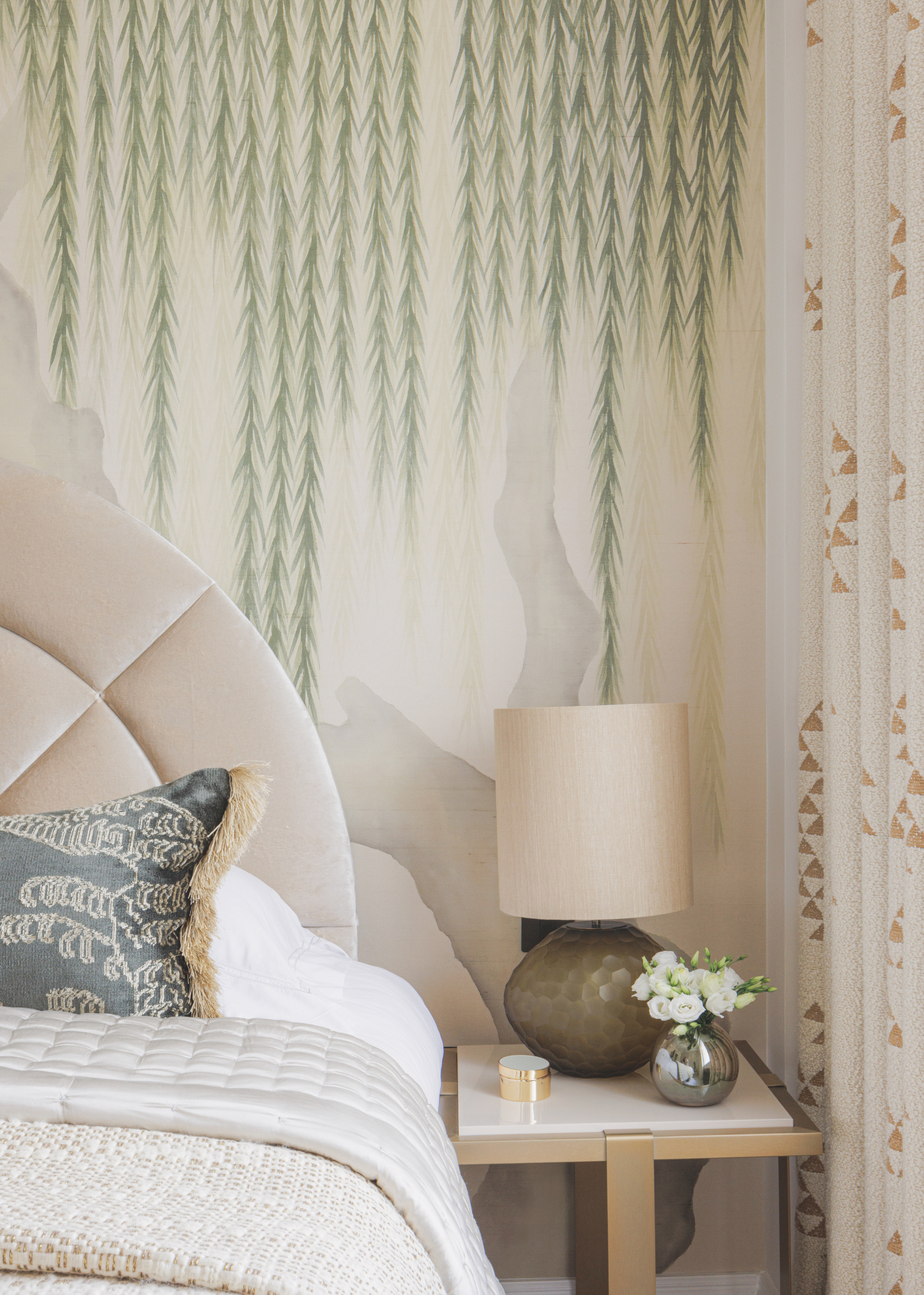 Patterned wallpaper with green trailing leaves falling from the ceiling.