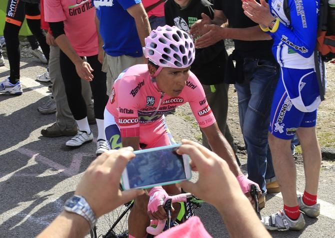 Nairo Quntana (Movistar) works his way through the fans on the Monte Grappa