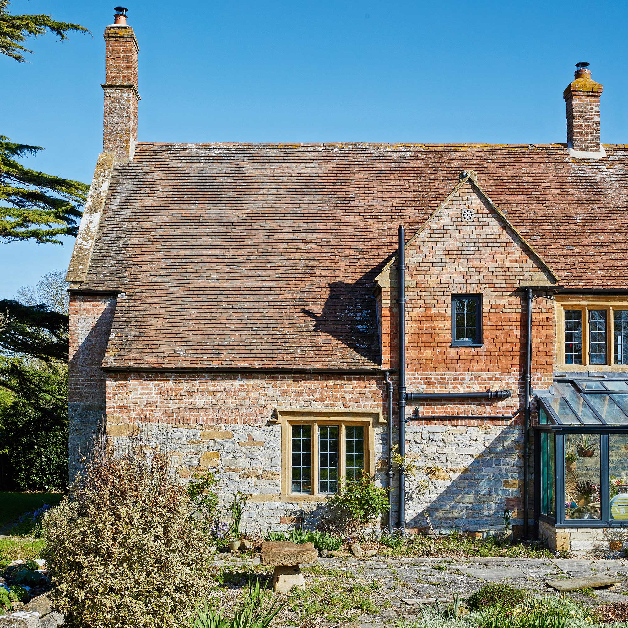 exterior of part of a 17th century english manor house with stone mullion windows