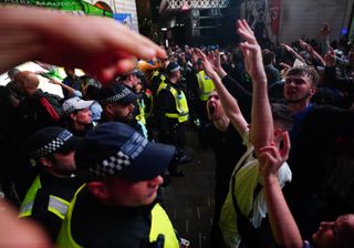 England fans clash with police in Piccadilly Circus, London, after Italy beat England on penalties to win the Euro 2020 final