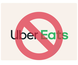 The uber eats logo with a no entry sign over the top of it