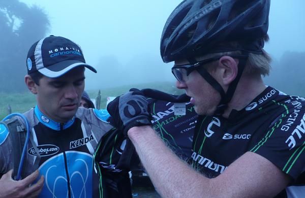 Alex Grant throws on a jacket before the major descent.