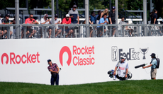 Rickie Fowler hits a chip shot at the Rocket Classic
