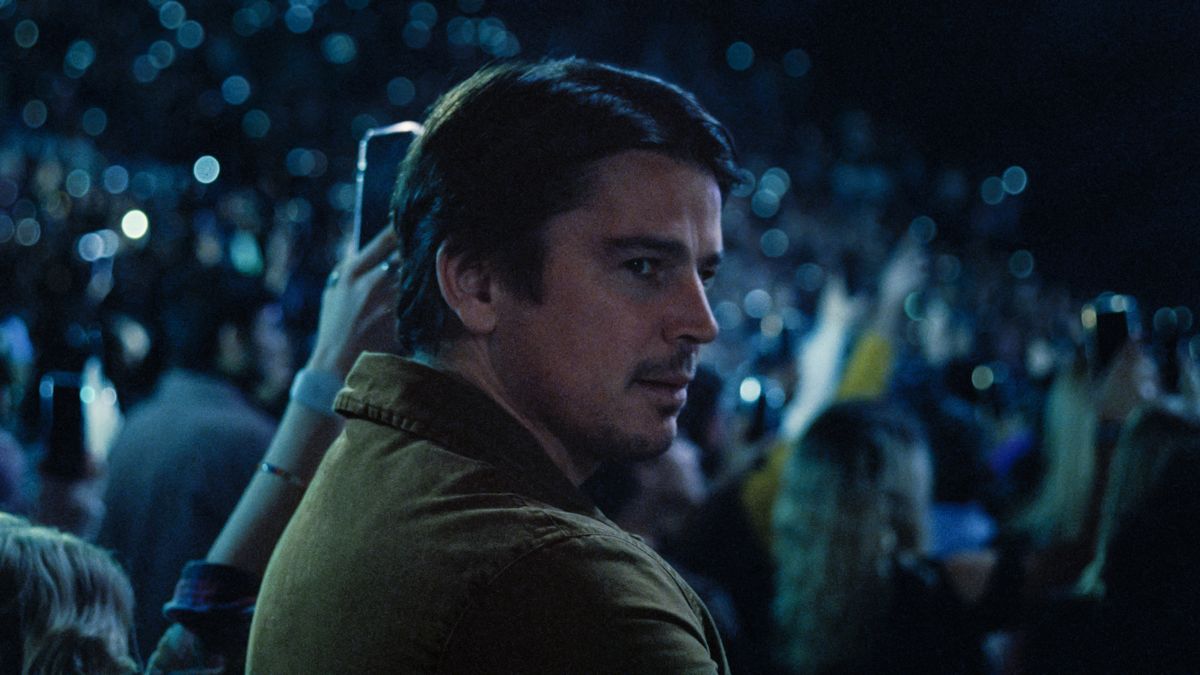 Josh Hartnett stands suspiciously amid a crowd of concert goers in Trap.