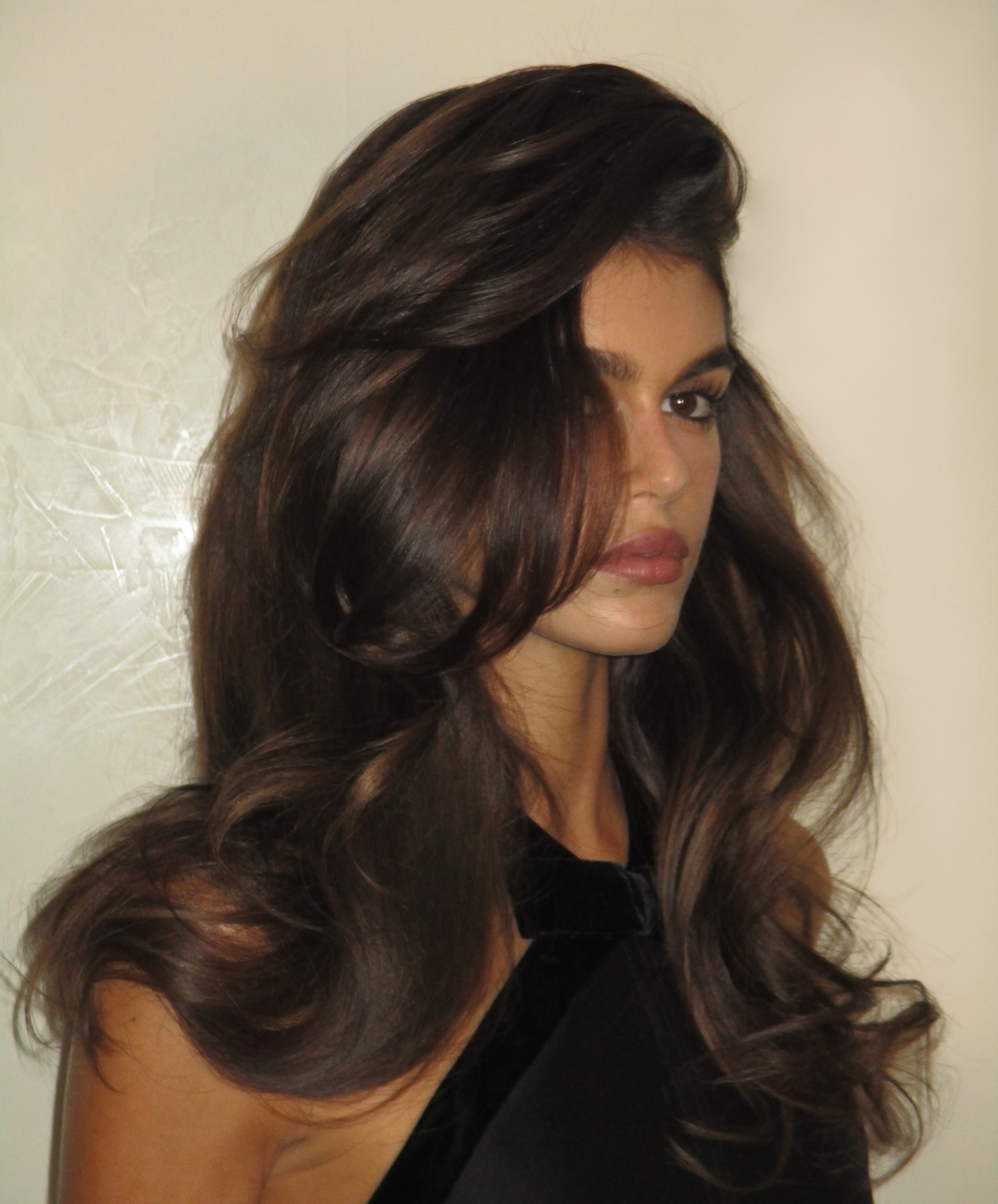 Kaia Gerber with a voluminous blowout hairstyle.