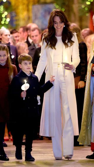 Catherine, Princess of Wales and Prince Louis of Wales process out of The "Together At Christmas" Carol Service
