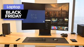 Samsung Galaxy Ark 55-inch monitor on a wooden desk next to the Xbox series X game console