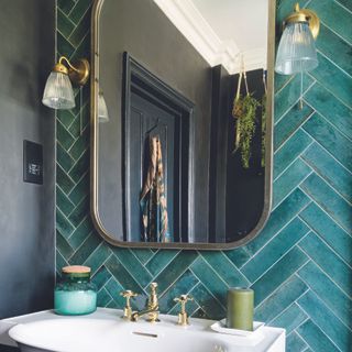 Bathroom with dark walls and green tiled wall