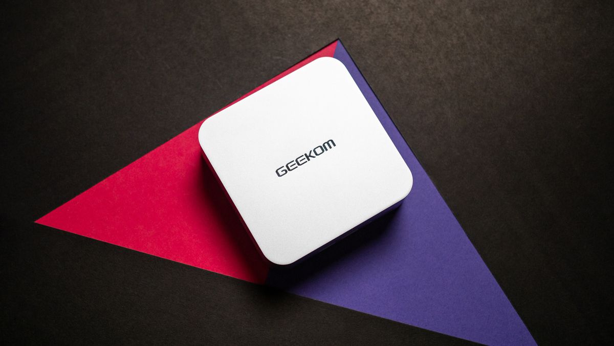 Geekom A7 mini PC design showcase against colorful background