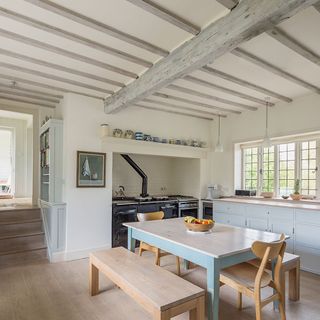 kitchen with table and fruit bowl and wooden bench