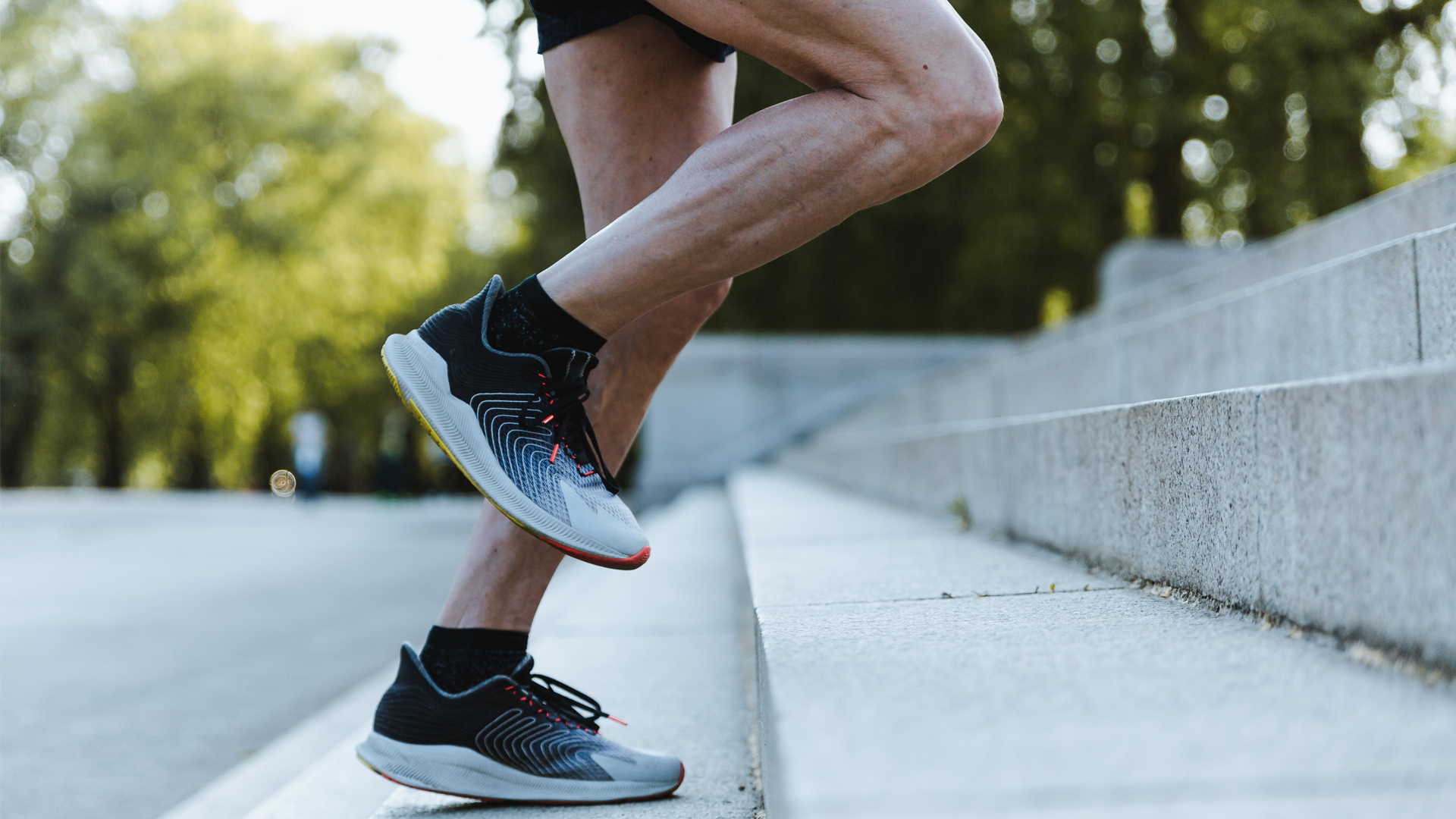 Person's feet running up steps outdoors