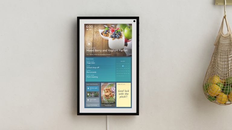 Amazon Echo Show 15 mounted to the wall in a kitchen, with groceries nearby