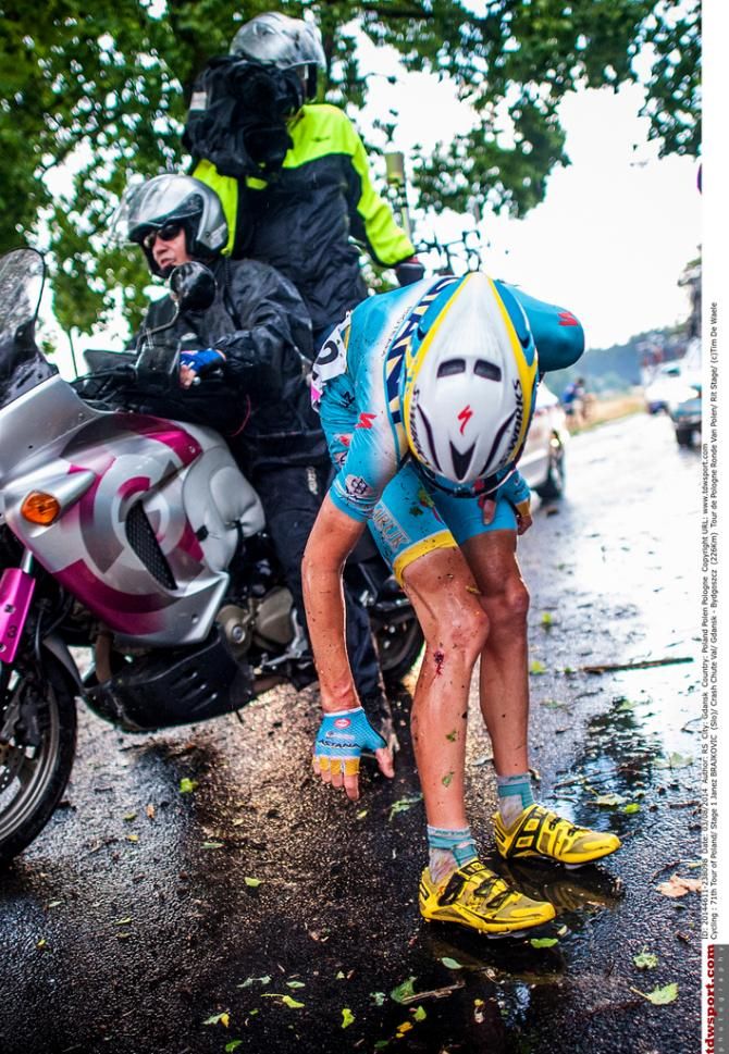 Janez Brajkovič (Astana) checks his injuries that forced him out of the race