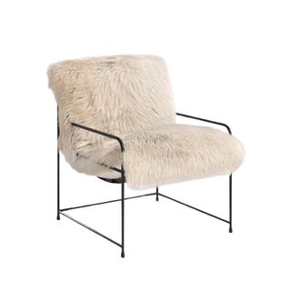 A sheepskin white boxy chair with thin black legs and arms