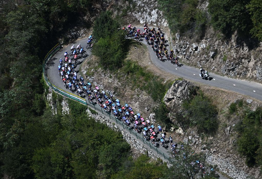 The pack of riders cycle in the ascent of Montvernier during the 11th stage of the 109th edition of the Tour de France cycling race 1517 km between Albertville and Col du Granon Serre Chevalier in the French Alps on July 13 2022 Photo by AnneChristine POUJOULAT AFP Photo by ANNECHRISTINE POUJOULATAFP via Getty Images