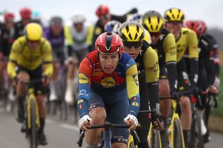 The pack of riders cycles during the 2nd stage of the Paris-Nice cycling race, 183,9 km between Montesson and Bellegarde, on March 10, 2025. (Photo by Anne-Christine POUJOULAT / AFP)