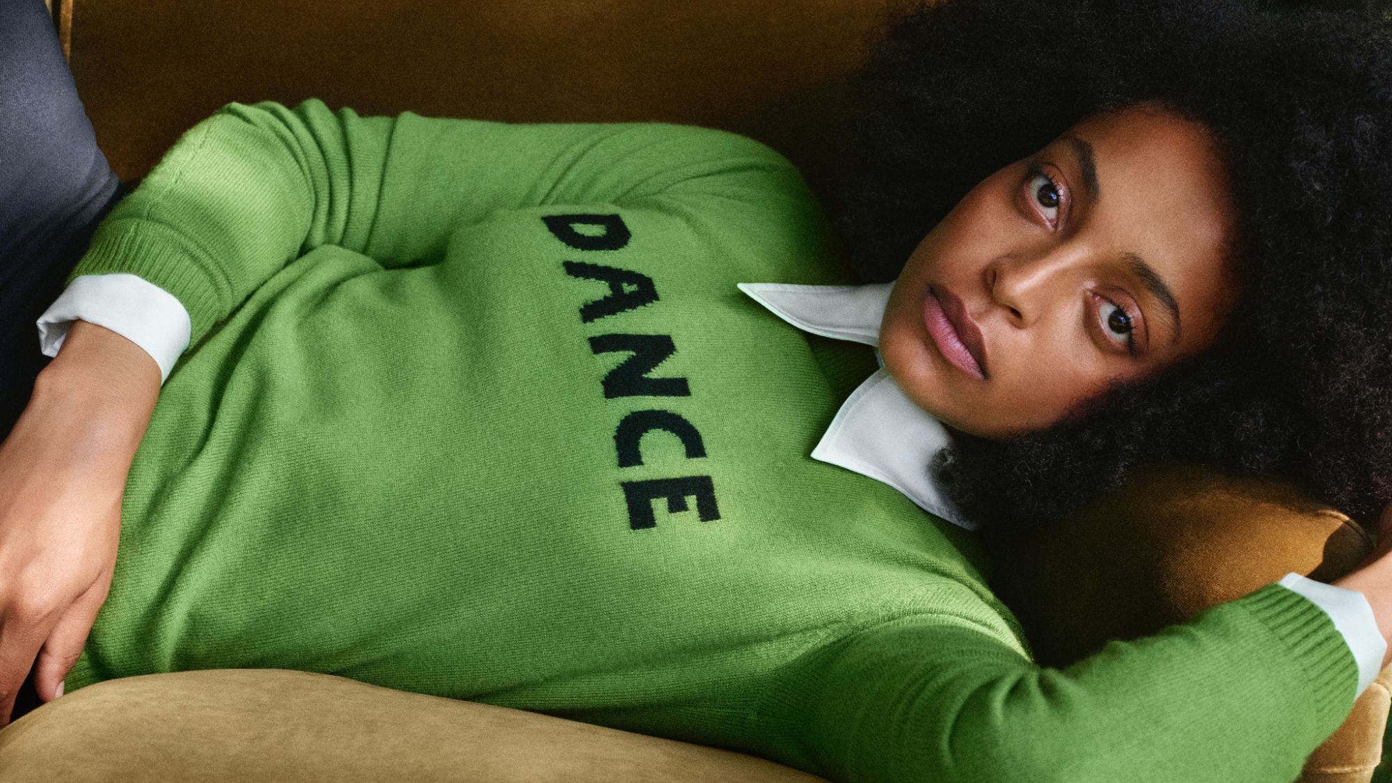 a model wearing a green dance jumper from the bella freud M&S collaboration