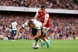 Sokratis Papastathopoulos, right, challenges Harry Kane in the penalty area