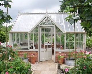 greenhouse exterior with planting