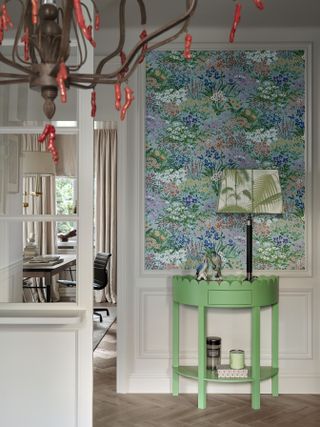 Entryway with green storage and wallpaper