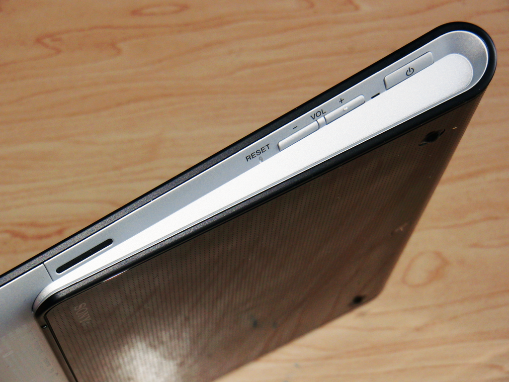 Right Side: Speaker, Volume & Power Buttons