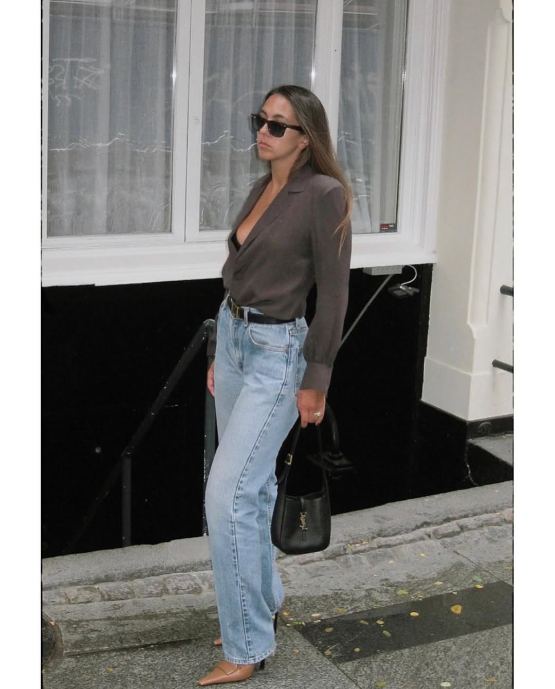 Hanna MW wearing a silk shirt tucked into vintage jeans