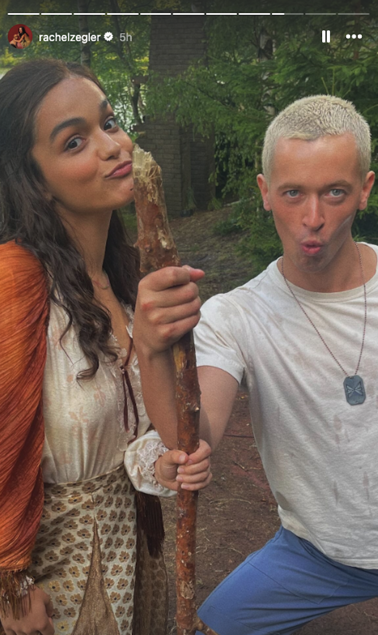 Rachel Zegler and Tom Blyth making funny faces while shooting The Ballad of Songbirds and Snakes in the forest