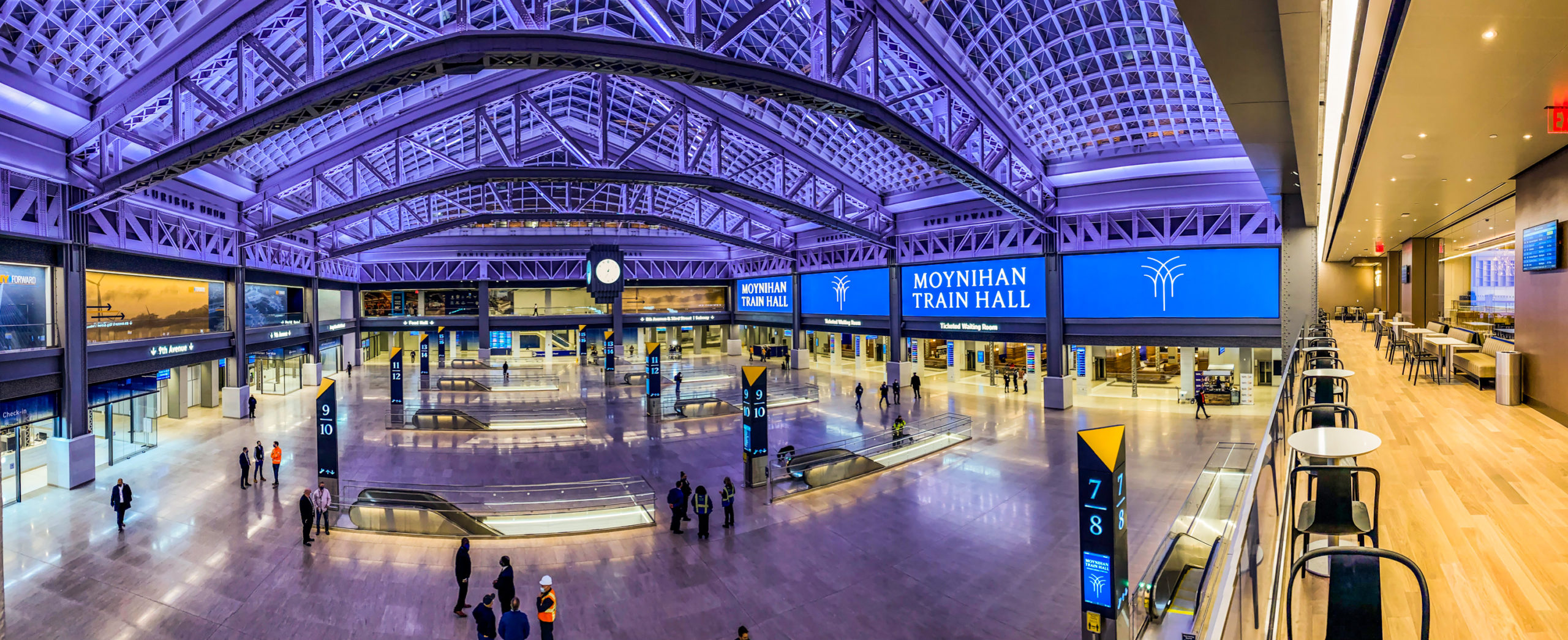 Travelers are greeted in the main hall of the Moynihan Train Hall by 1,700 square feet of direct view LED screens, separated into four distinct panels, that run along one side of the expansive room.