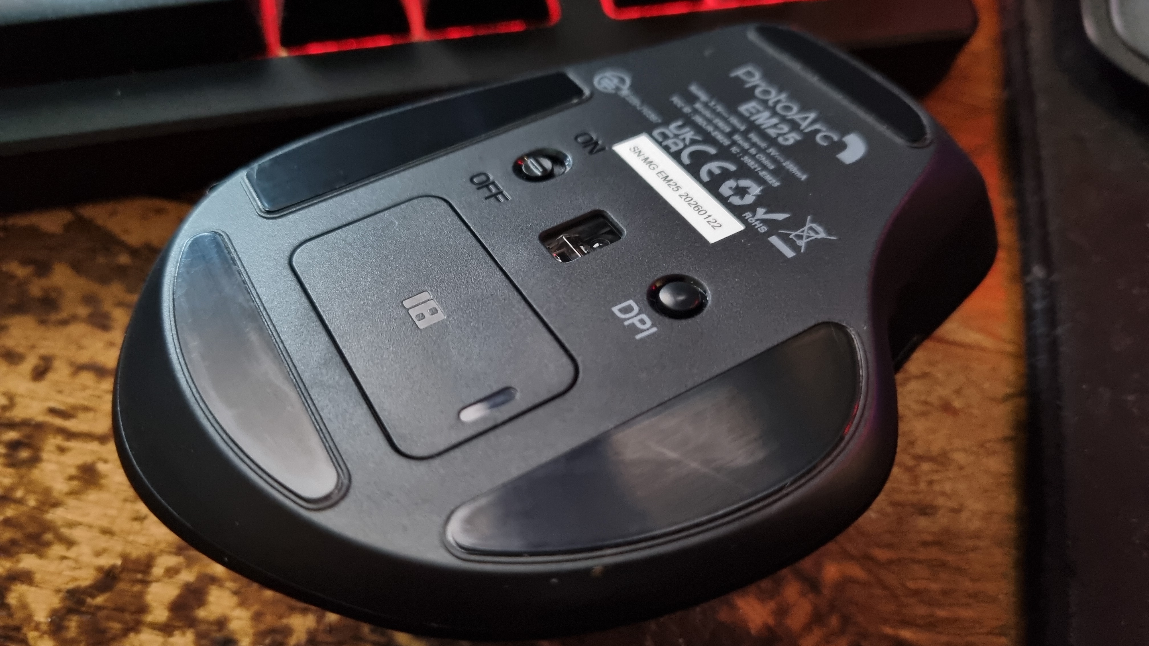 The underside of a ProtoArc EM25 ergonomic mouse