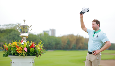 Brian Campbell next to the Mexico Open trophy