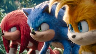 Knuckles, Sonic, and Tails stand lined up together in the jungle in Sonic the Hedgehog 3.