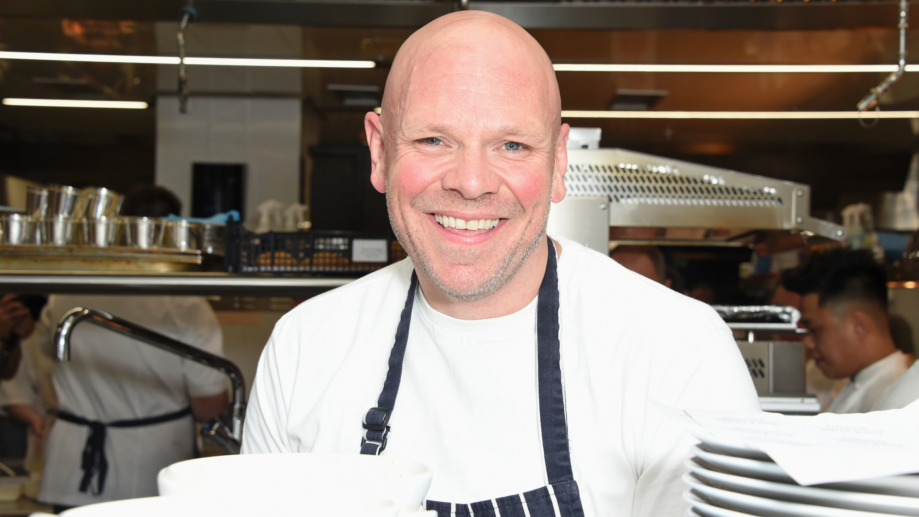 Tom Kerridge prepares food in the kitchen at Who's Cooking Dinner? 2018.