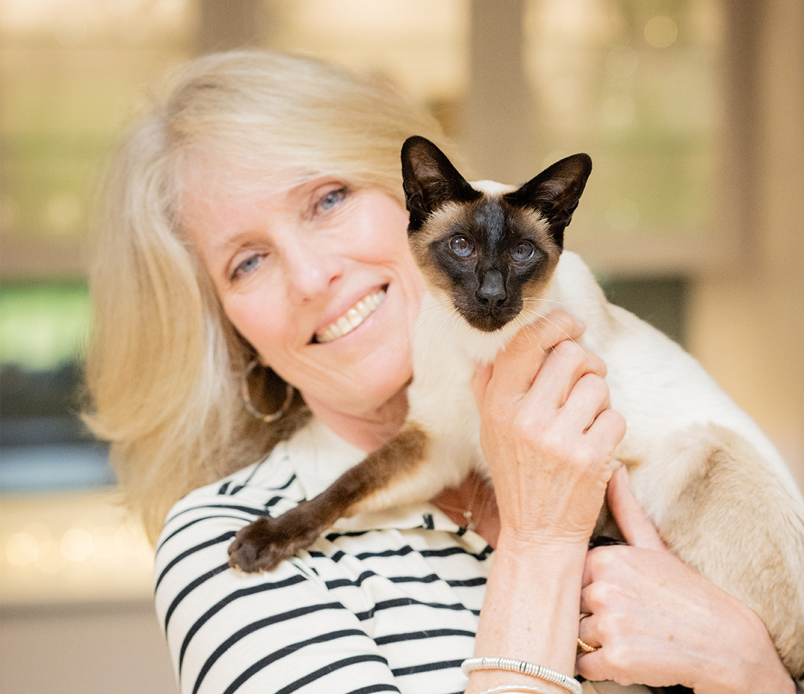 Julie Shute and Frank the Siamese cat