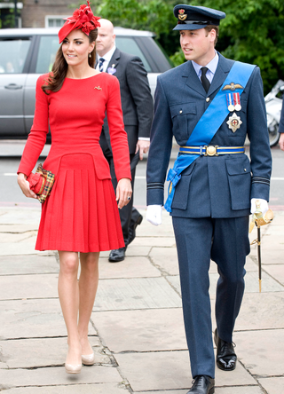 Prince William (R) and Catherine, Duchess of Cambridge (L) prepare to board the royal barge 'Spirit of Chartwell' during the Thames Diamond Jubilee Pageant on the River Thames in London on June 3, 2012