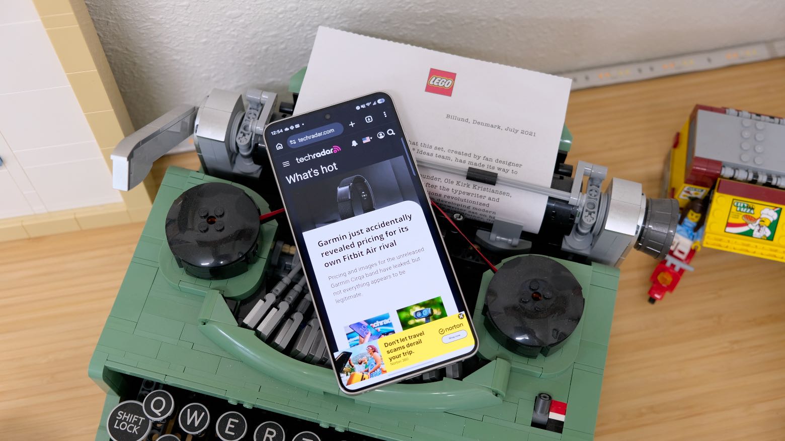 The Samsung Galaxy S26 resting on a wooden table