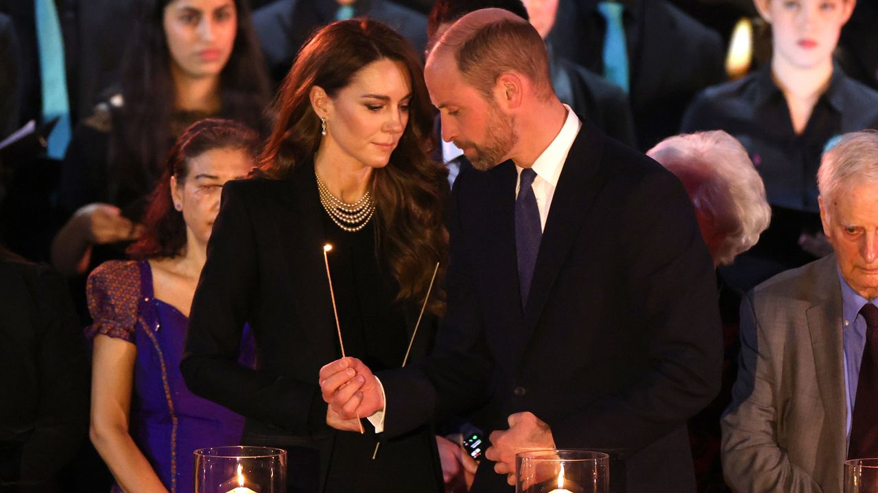 Catherine, Princess of Wales and Prince William, Prince of Wales light candles during a ceremony commemorating Holocaust Memorial Day on January 27, 2025