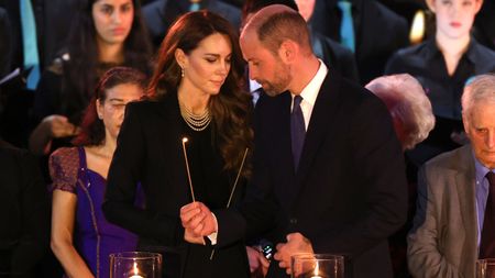 Catherine, Princess of Wales and Prince William, Prince of Wales light candles during a ceremony commemorating Holocaust Memorial Day on January 27, 2025