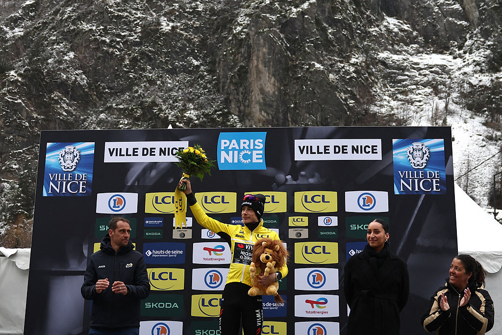 Team Visma - Lease a Bike's Danish rider Jonas Vingegaard celebrates his overall leader yellow jersey on the podium after the 7th stage of the Paris-Nice cycling race, 47 km between Le Broc and Isola-Village, on March 14, 2026. Due to deteriorating weather conditions, the route of stage 7 has been changed to a 47 km race from Le Broc to Isola. (Photo by Anne-Christine POUJOULAT / AFP)