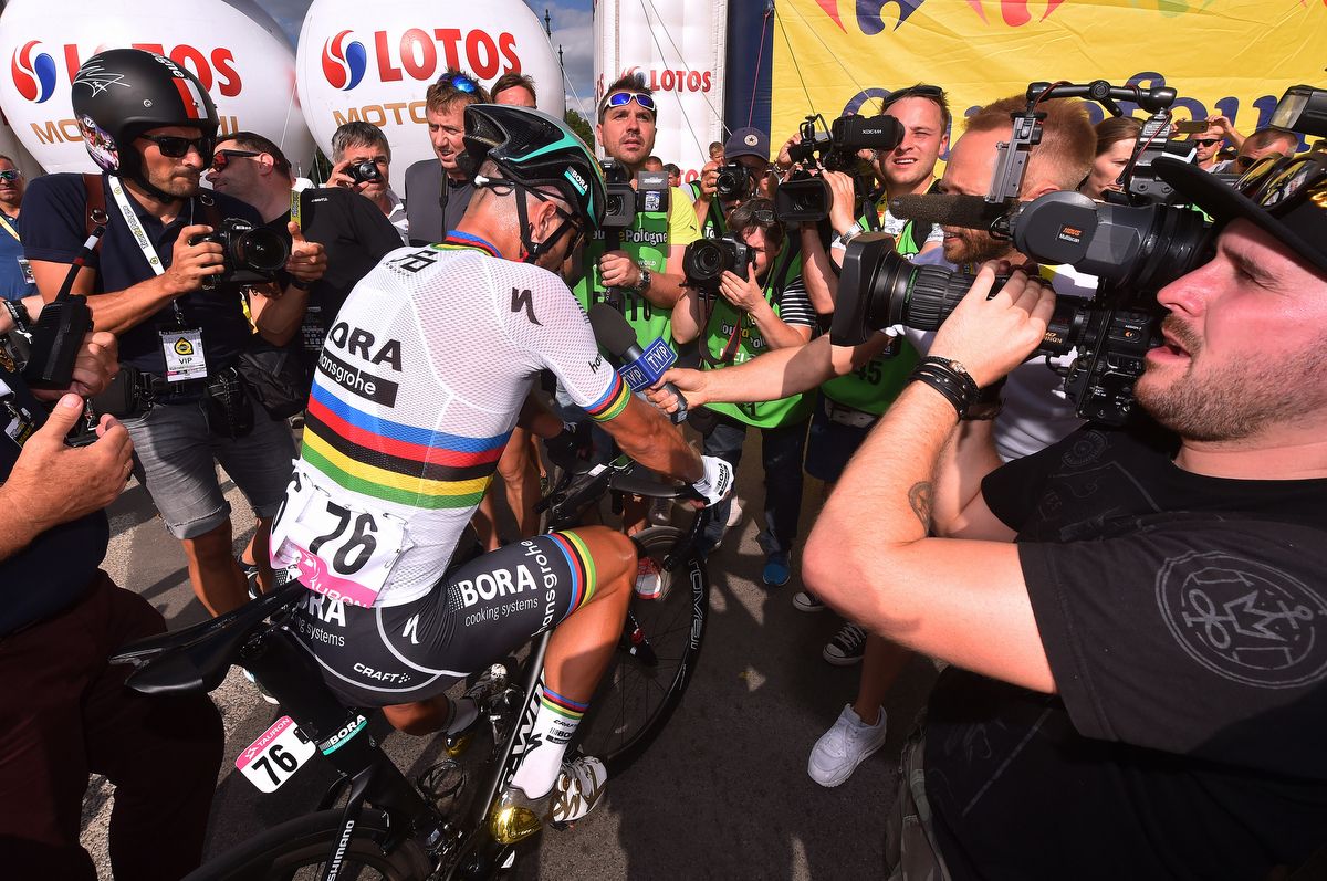 The photographers crowd Peter Sagan for a photo